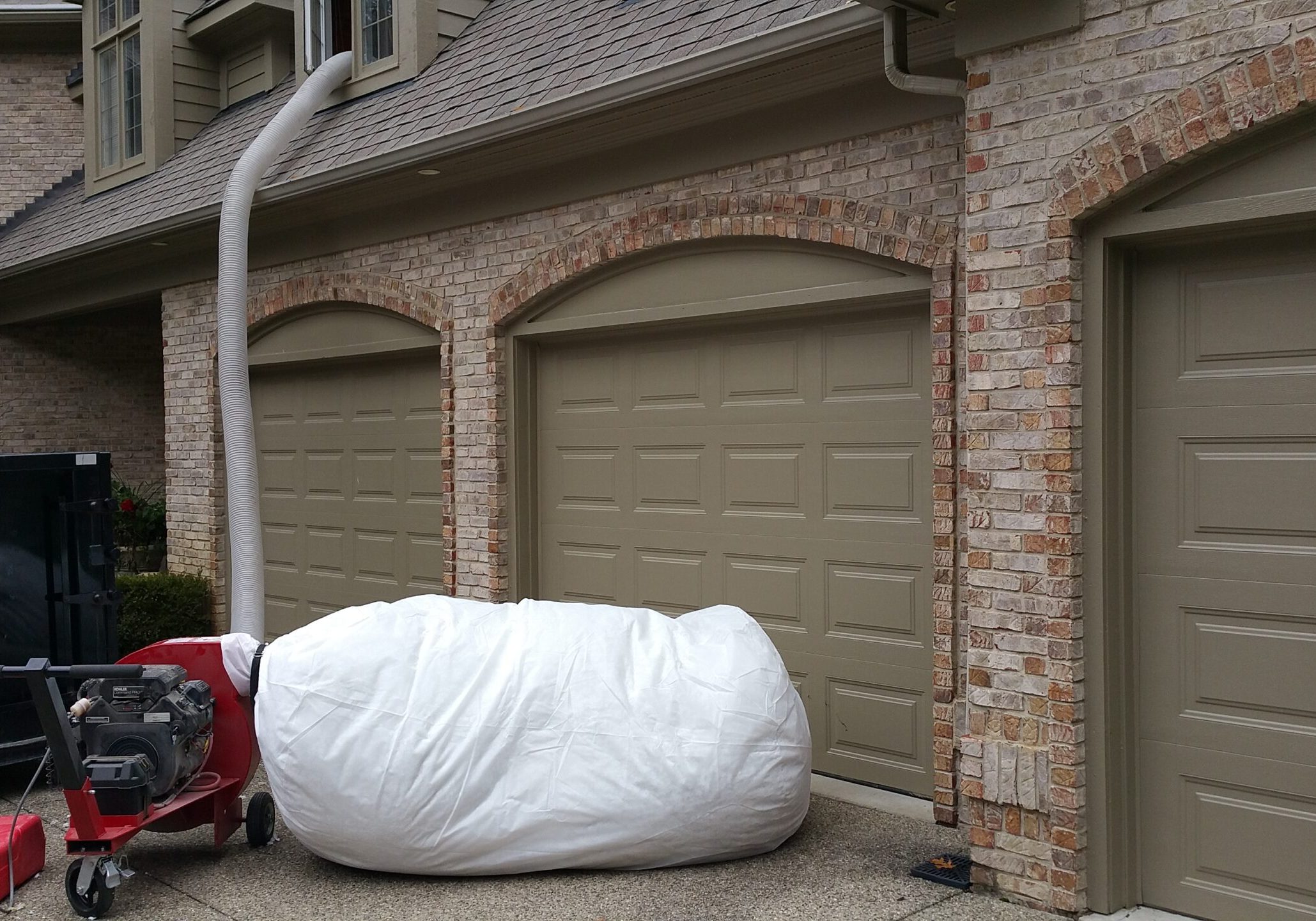 Removing contaminated insulation from the attic
